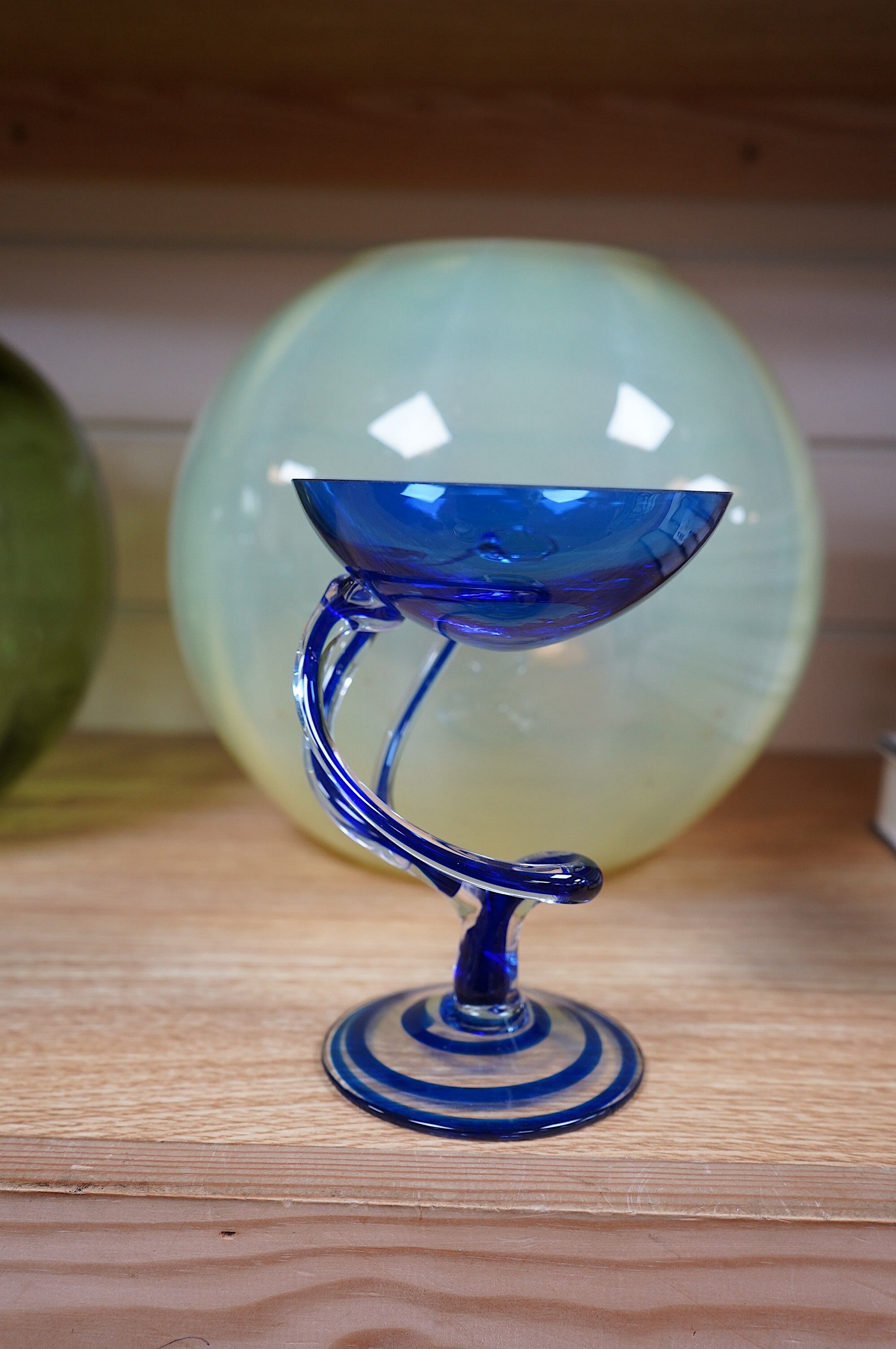 A Midsummer Glassmakers iridescent blue glass vase, a Jozefina Krosno art glass pedestal dish, a vaseline glass jardiniere and another, tallest 21.5cm. Condition - good